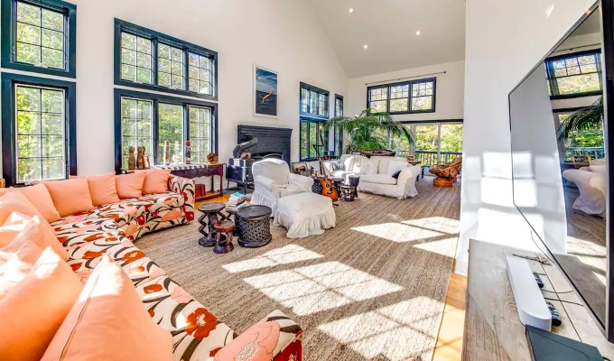 Best Airbnbs in the Hamptons - A large living room with high ceilings in a Hamptons home.