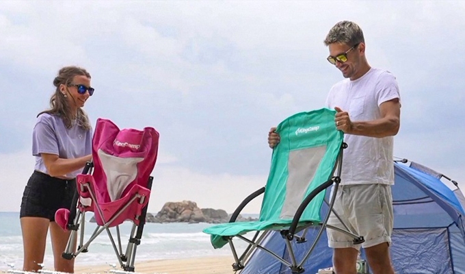 Best beach chairs: A couple gets ready to fold up two beach chairs