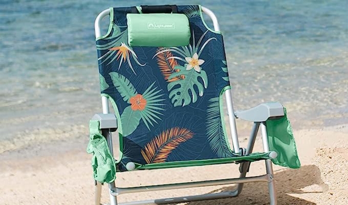 Best beach chairs: A green printed beach chair with a pillow headrest