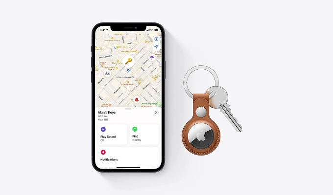Best last-minute Father's Day gift: An Apple AirTag in a keychain next to a phone