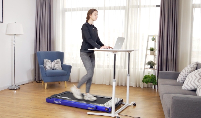 Best Under-Desk Treadmills:A model walking on a treadmill in her home