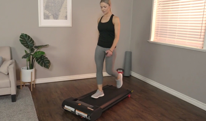 Best Under-Desk Treadmills: A model walking on a treadmill at home
