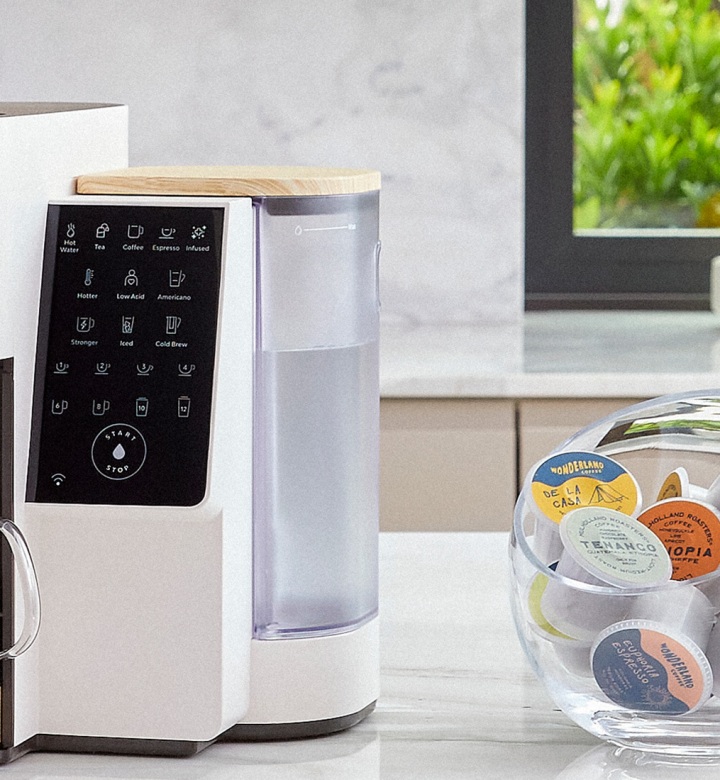 bruvi review: bruvi single-serve coffee machine on kitchen island, next to bowl of B-Pods