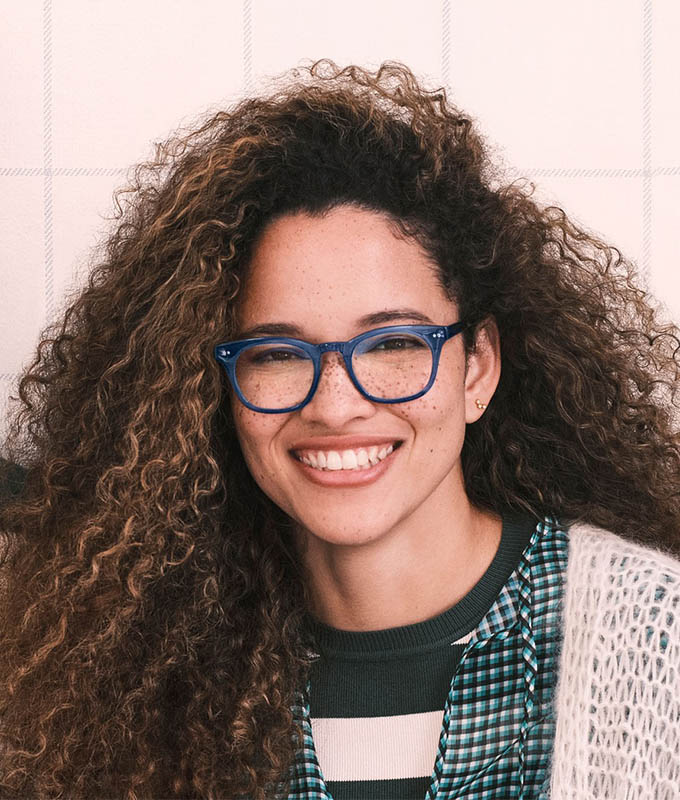 Glasses trends: Blue Wardy Parker frames on young woman