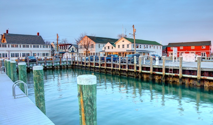 Places Like the Hamptons - A colorful and bright dock in Greenport. The buildings are painted colorfully and the sky is clear.