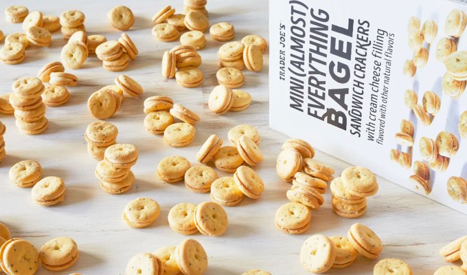 new at trader joe's june 2023: mini everything bagel sandwich crackers scattered on kitchen counter, with a box of them
