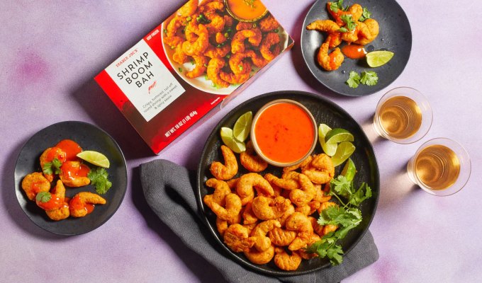 new at trader joe's june 2023: plate of shrimp boom bah next to two smaller plates of it