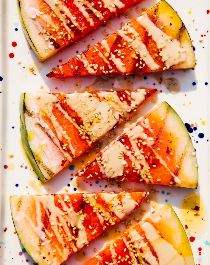 lazy summer entertaining recipes grilled melon with tahini chili oil and sesame seeds
